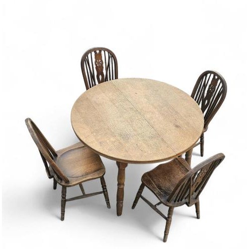 A bit wearthered windsor wheelback dining set (7) by the Oirschotse meubelindustrie 1950s Table /Height 84Width 110 /...