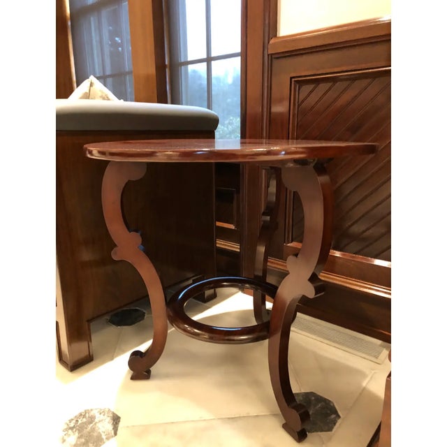 Beautiful American Empire side table circa 1840. This round table is mahogany with a french polish finish. It is in...