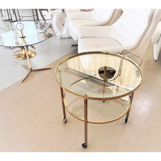 Beautiful elegant serving trolley or bar cart from the 1970s with four wheels made of excellent quality. The beauty of...