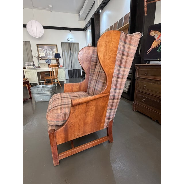 Love the clean lines of the wings and the conical flared armrests! This chair is ready for new upholstery and some more...