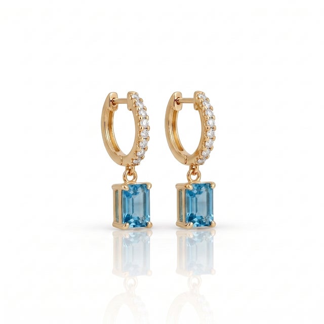 Elevate your daily ensemble with these breathtaking drop huggie hoop earrings featuring a sparkling pavé-set hoop and a...