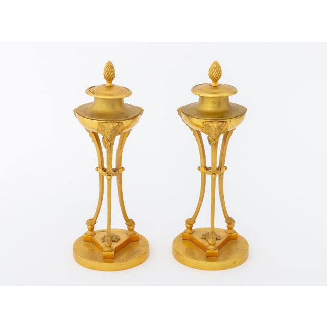 Pair of Louis XV Style Ormolu Cassolettes, late 19th century, the lids surmounted by pinecone finial, reversible and...