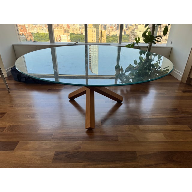 Elevate your dining space with this stunning Aikido round dining table, featuring a generous 67-inch clear glass top that...