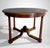A large and captivating Italian round table distinguished by its harmonious proportions and refined elegance. The legs,...