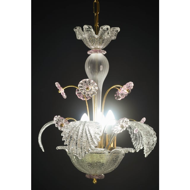 Vintage Murano glass chandelier with pink flowers and white leaves. The chandelier consists of 10 pink flowers and 5 low...
