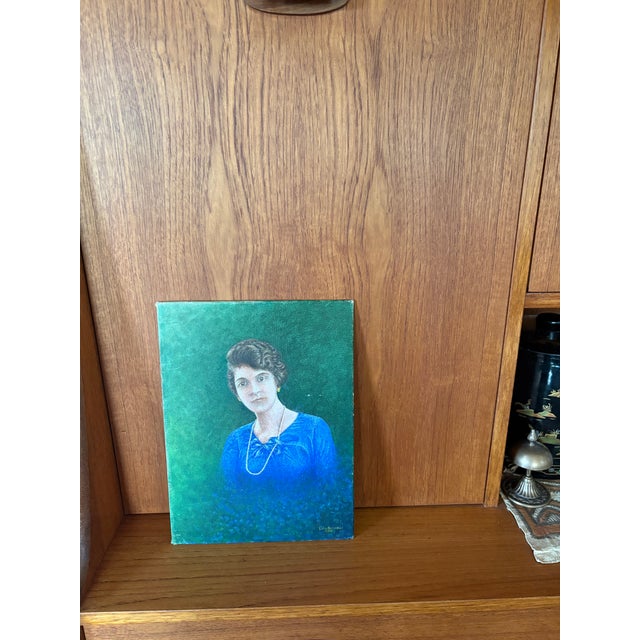 Refined mid-century portrait painting of a woman, signed and dated 1968 (lower right, Luigi Altobelli). Executed in oil on...