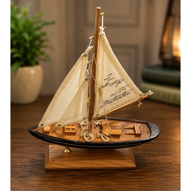 Add a touch of nautical charm and inspirational décor to your home with this **Vintage Wooden Sailboat Yacht Sculpture**,...