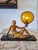 An Art Deco spelter lady lamp, circa 1930, Germany. One of a kind with art glass. Length 14.5" x Height 12". Wear and tear...