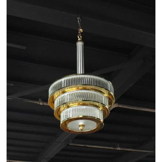 Very nice Mid-Century modern glass prisms and brass three-tier Camer or Murano style light fixture.