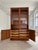 This beautiful teak display cabinet is an outstanding example of masterful Danish design from the mid-century era,...