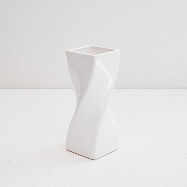 Twisted Vase in White Glazed Ceramic 1980s. This is a wonderful white glazed ceramic vase with a postmodern shape. The...