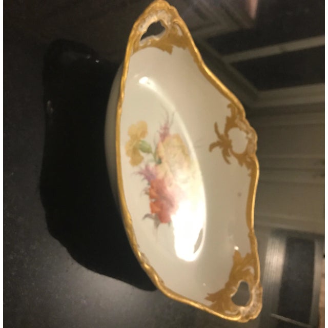 Antique 19th century hand painted porcelain with floral and gilt decoration. The bowl with center floral decoration with...