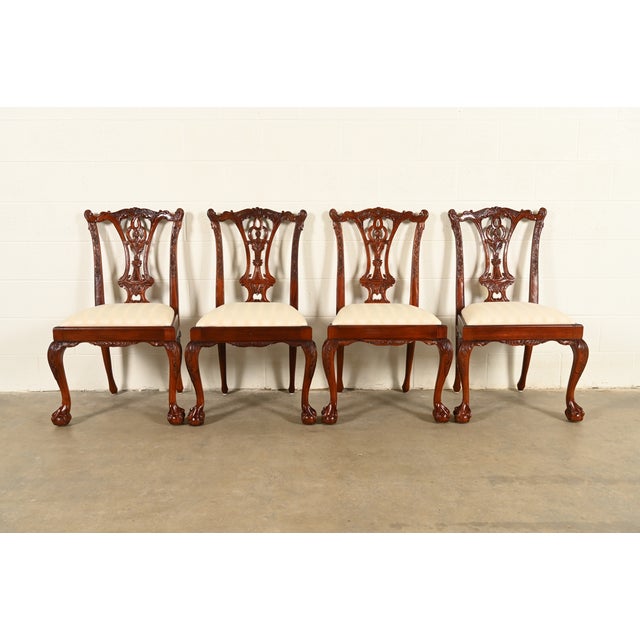 An outstanding set of four Chippendale or Georgian style side chairs or dining chairs In the manner of Baker Furniture...