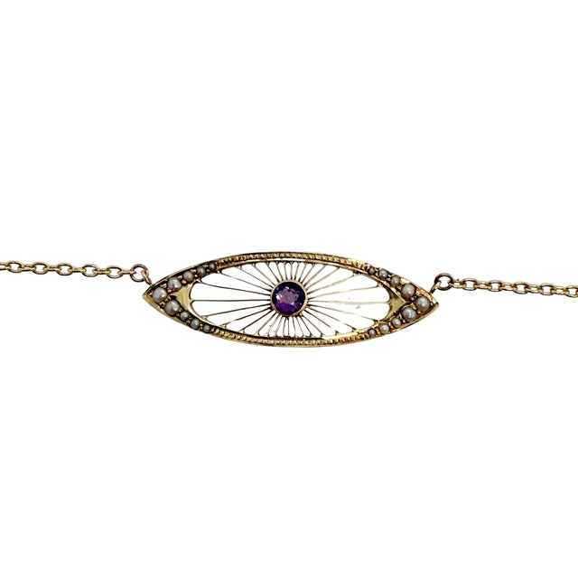 This Edwardian centerpiece dates to about 1900 and has been reimagined as a delicate necklace. A round, faceted amethyst...