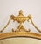 Antique early 20th century Adam style hand carved giltwood and gesso oval mirror with urn crest, bell flowers swags and...