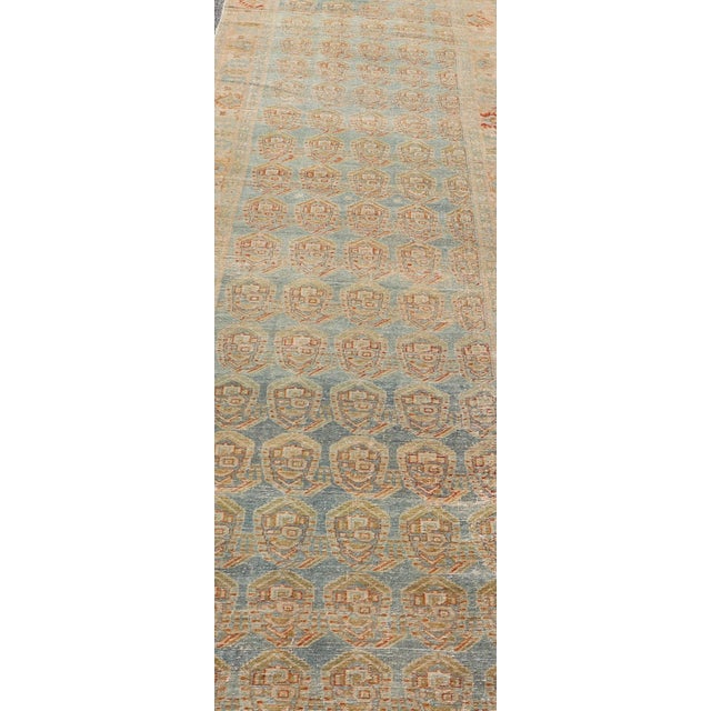 Measures: 3'8 x 16'7 Antique Persian Malayer Runner with Paisley Design in Light Blue Background. Keivan Woven Arts / rug...