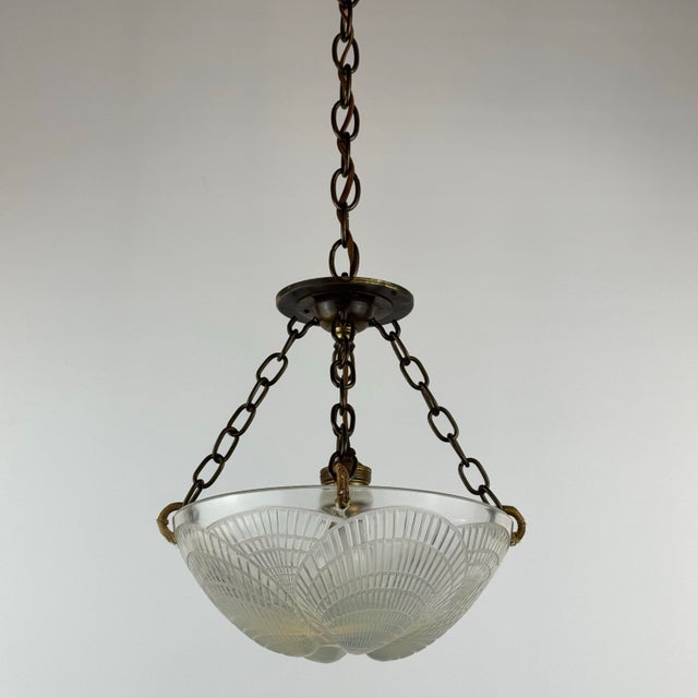Antique French Lalique, classic coquille design on this opalescent glass with aged brass hardware. 30” Height 9.5” Width 1...