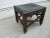 This low stool or footstool has that wonderful Arts & Crafts, Mission style look. The black leather with the brass-colored...