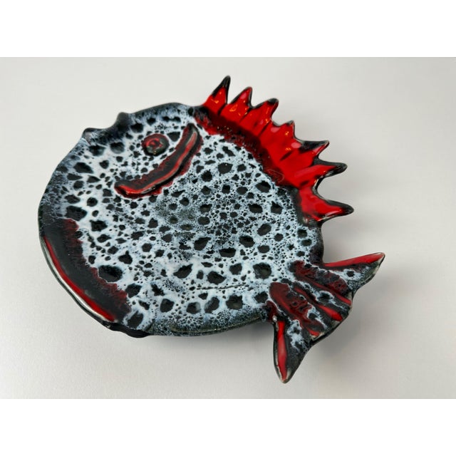 Striking fat lava serving dish. Ceramic. Marked. Vallauris. Width: 27cm. Height: 23cm. Depth: 4.5cm. Weight: 800g. This...