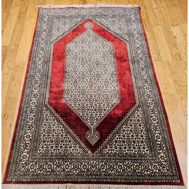 "Indulge in the unparalleled luxury and exquisite craftsmanship of this Vintage Persian Silk Qum Area Rug, a testament to...