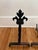 Petite French fleur-de-lis andirons made of cast iron. Circa mid 20th century. The fleur-de-lis is one of the most...