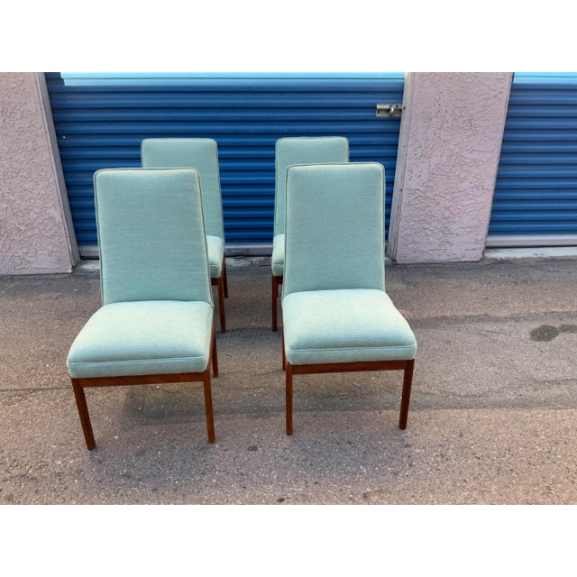 Mid century dining chairs. Made by Sux of Sweden. Chairs were newly upholstered in a teal chenille. The bases are teak....