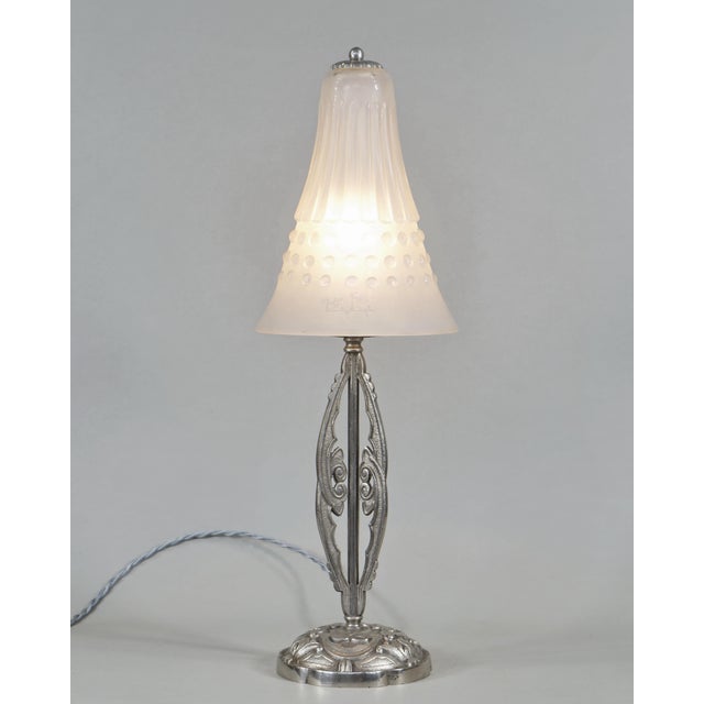 Muller frères A wonderful French art deco lamp in nickel plated solid brass or bronze, around 1925-1930. It holds a rare...