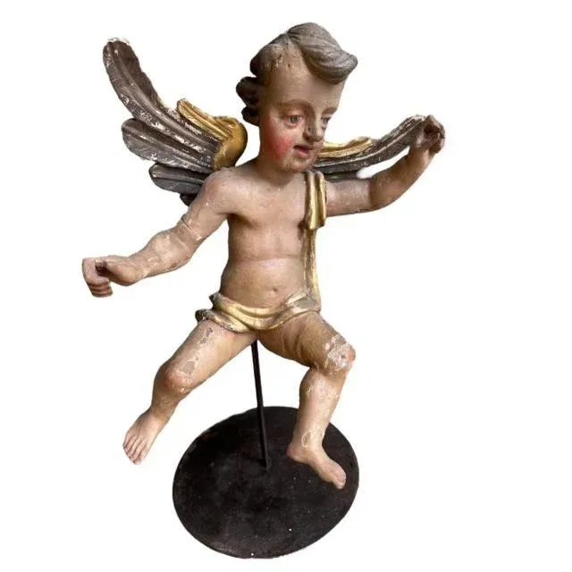 A pair of early 18th century Baroque putti cherub sculptures on custom made stands — the pieces turn on the stands, with...