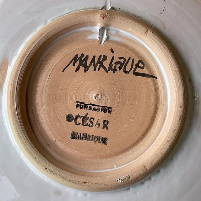 Add a touch of vintage boho flair to your space with this one-of-a-kind, hand-painted ceramic plate. Crafted with a glazed...