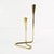 This candlestick is from Denmark, 1960s. It features a minimalist, spacious, modern design. Made of brass. Condition: good...