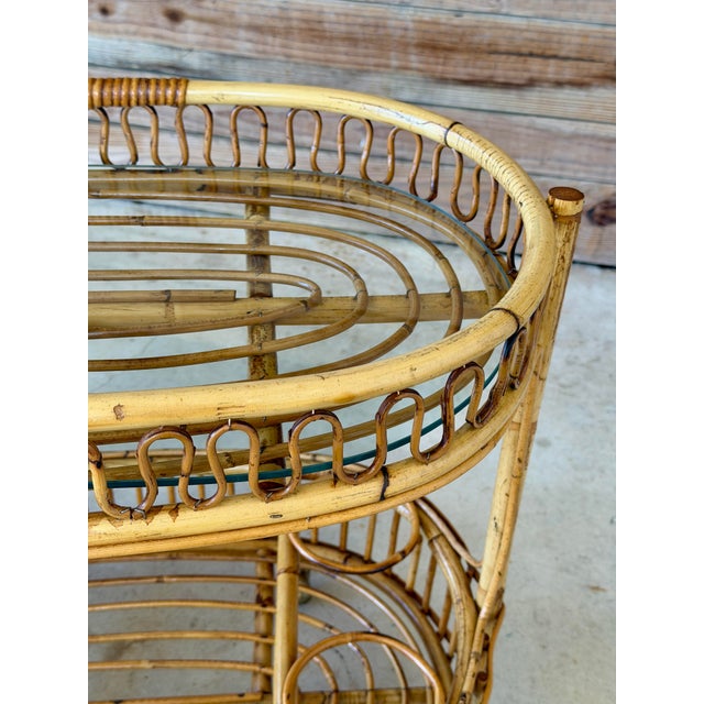 Elevate your entertaining space with this striking mid-century modern Italian rolling bar cart, designed in the...