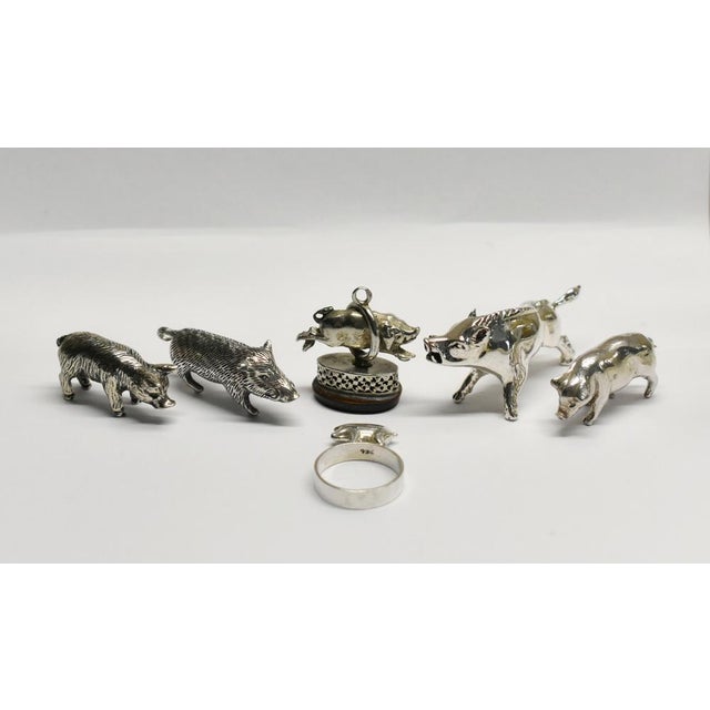Collection of six silver pigs & wild boar a delightful collection of six miniature pigs and wild boar in solid silver with...