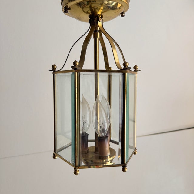 Hexagonal beveled glass and brass lantern. Flush mount. Three light cluster. Has been cleaned. Has not been rewired. Circa...