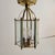 Hexagonal beveled glass and brass lantern. Flush mount. Three light cluster. Has been cleaned. Has not been rewired. Circa...