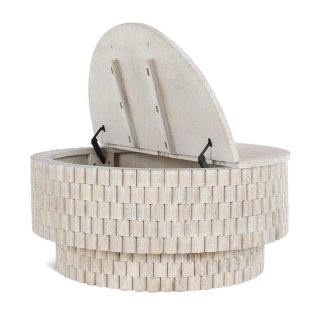 Fresh light white washed mango wood coffee table. Modern round design with curved pieces adorning the outside. Top lifts...