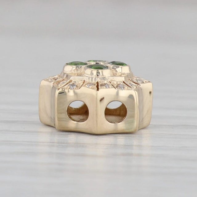 Gemstone Information: - Natural Chrome Diopside - Carats - 0.16ctw Cut - Round Color - Green - Natural Diamonds - Total...