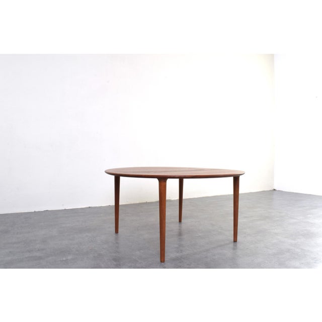 This teak coffee table was designed in the 1960s by a pair of Norwegian designers Rolf Rastad and Adolf Relling and...