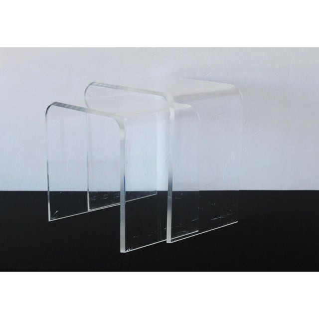 Pair of Vintage Modern Lucite Acrylic Waterfall Nesting Tables. Gorgeous beveled edge. Lots of signs of wear and use....