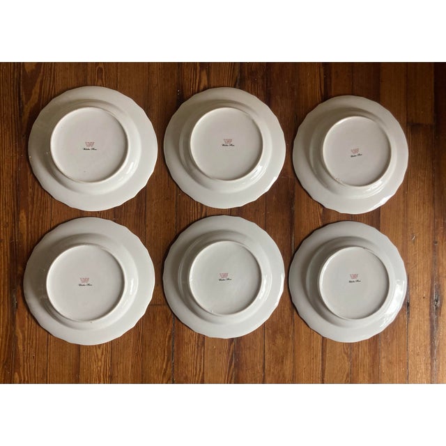 Each plate features a beautifully hand-painted style bird accented by colorful insects around the rim. The embossed...