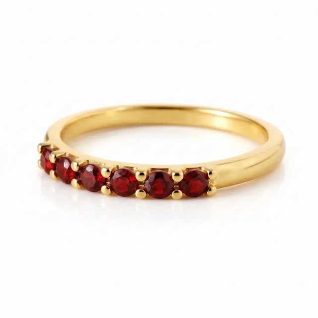 * There are 7 Stones in this Ring Bold, romantic, and full of meaning — this Garnet Ring features a richly colored...