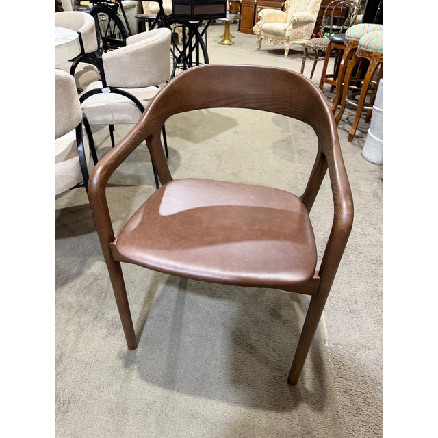 Elevate your dining space with this striking set of four “Amare” dining chairs by Four Hands, a design that blends modern...