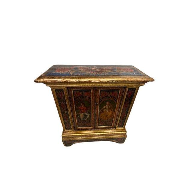 Exquisite mid-19th-century Florentine cabinet, hand painted with richly detailed classical figural scenes framed by ornate...