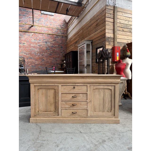 This antique elm sideboard has been fully restored. It features two lockable doors that open to reveal a shelf, and four...