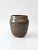 This vintage studio pottery mug is signed by the artist and showcases a striking earthy glaze in taupe, black, and maroon...