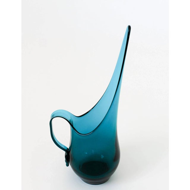 Beautiful blue mid-century Viking Glass pitcher. No makers mark. One very tiny chip and one small scuff. Both pictured.