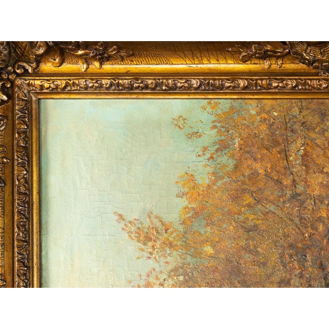 An early 20th Century fox hunting scene in a forest with two riders observing the hunting grounds. A painting of a...