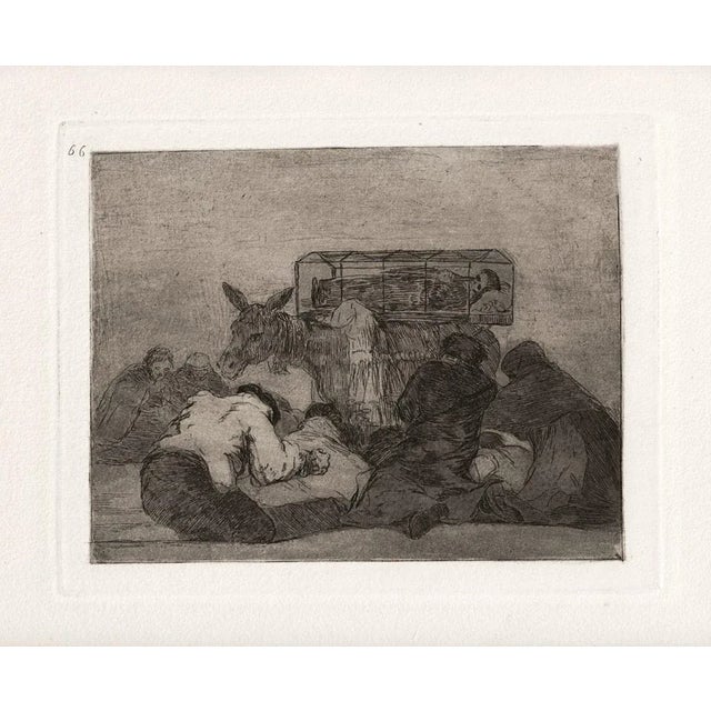 Extrana Devocion is an original artwork realized by the great Spanish artist Francisco Goya in 1810. Original Etching on...