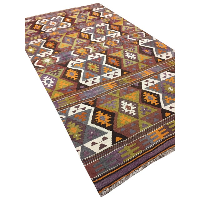 This vintage Turkish flat weave Kilim, hand-woven in the 1950s, exemplifies a blend of simplicity and boldness. Its...