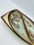 A captivating example of mid-century studio pottery, this hand-crafted ceramic trinket tray features an abstracted...