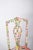 Painted dining chair. With a classic cut-out backrest, reinterpreted with a vibrant contemporary painting. The piece...